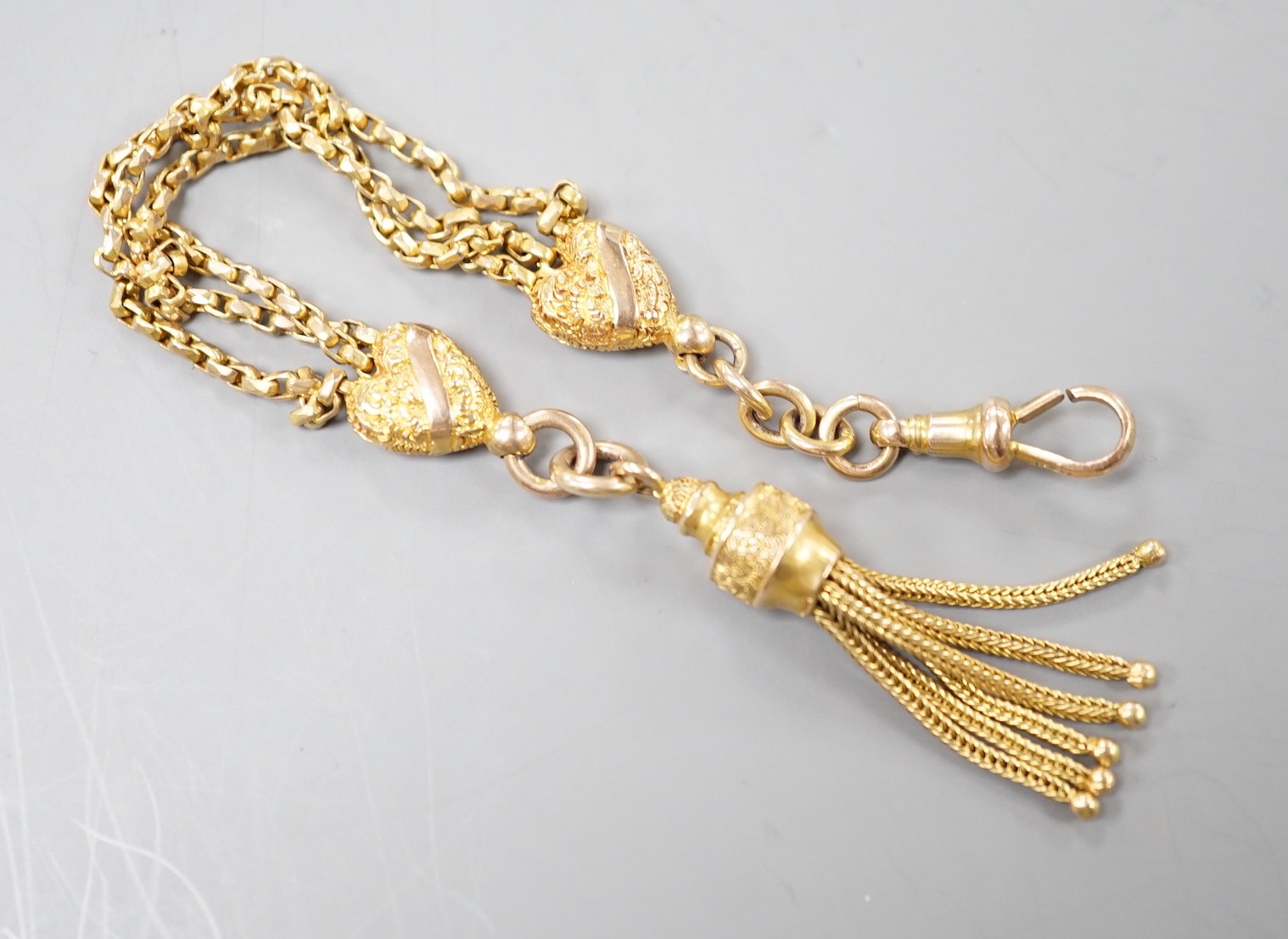 A 9c fob chain, with heart shaped motifs and tassel drop, 15cm, 8.2 grams.